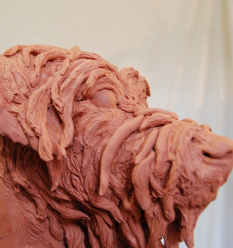 Building the hair on Milo's face in clay by JOEL 1