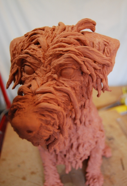 Building the hair on Milo's face in clay by JOEL 2