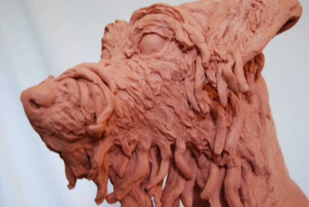 Building the hair on Milo's face in clay by JOEL 3