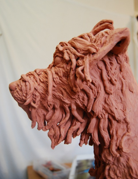 Building the hair on Milo's face in clay by JOEL 4