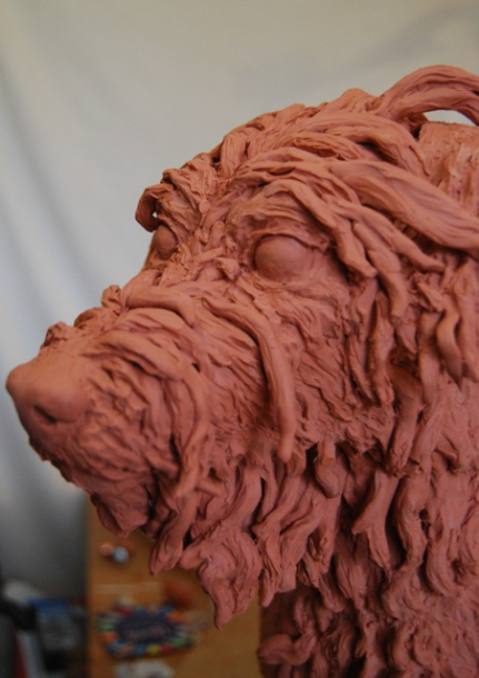 Building the hair on Milo's face in clay by JOEL 5