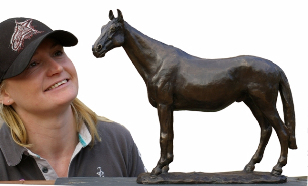 Delighted owner views horse statue