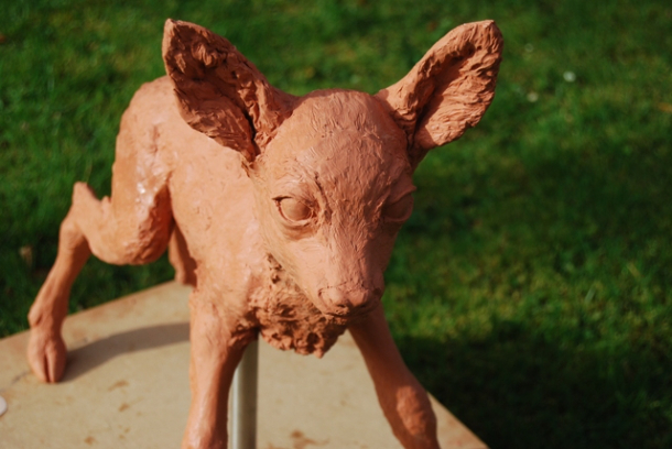 Details of fawn sculpture in the sunlight