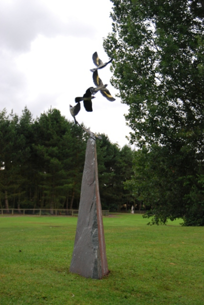 Flock of Goldfinches in Bronze on Obelisc