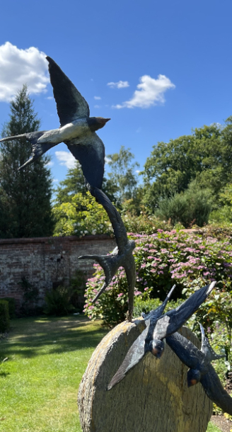 Four Bronze Swallows and Earth