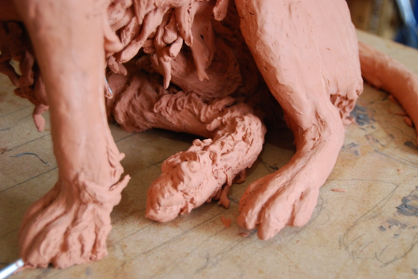 Milo dog sculpture clay stages on feet