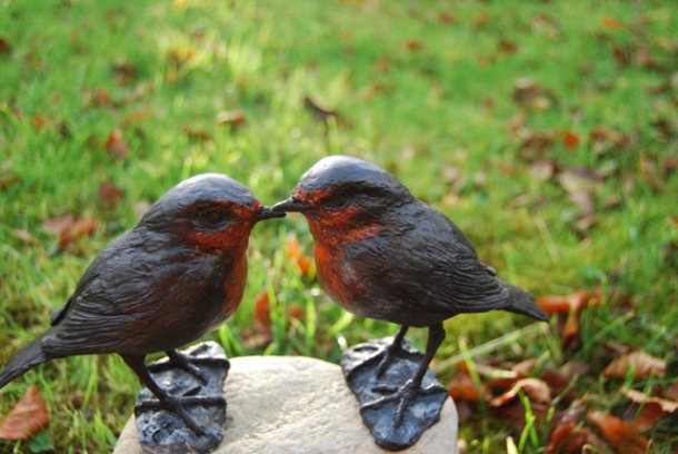 Robin Bronzes  on stone base by JOEL close up