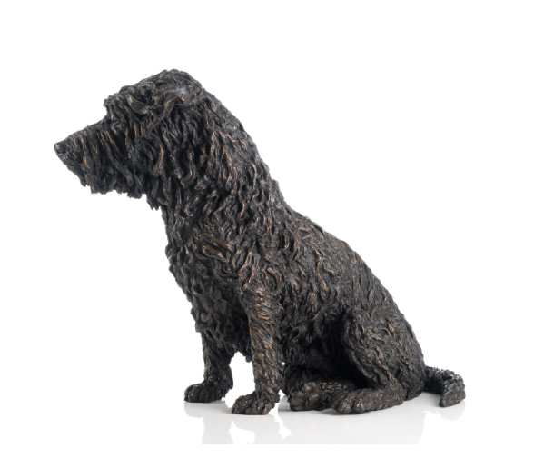 Sideview of bronze dog statue  by Sculptress JOEL 