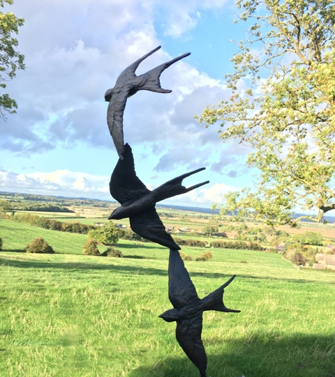 Three Swallow Flight against cloudy Sky by JOEL